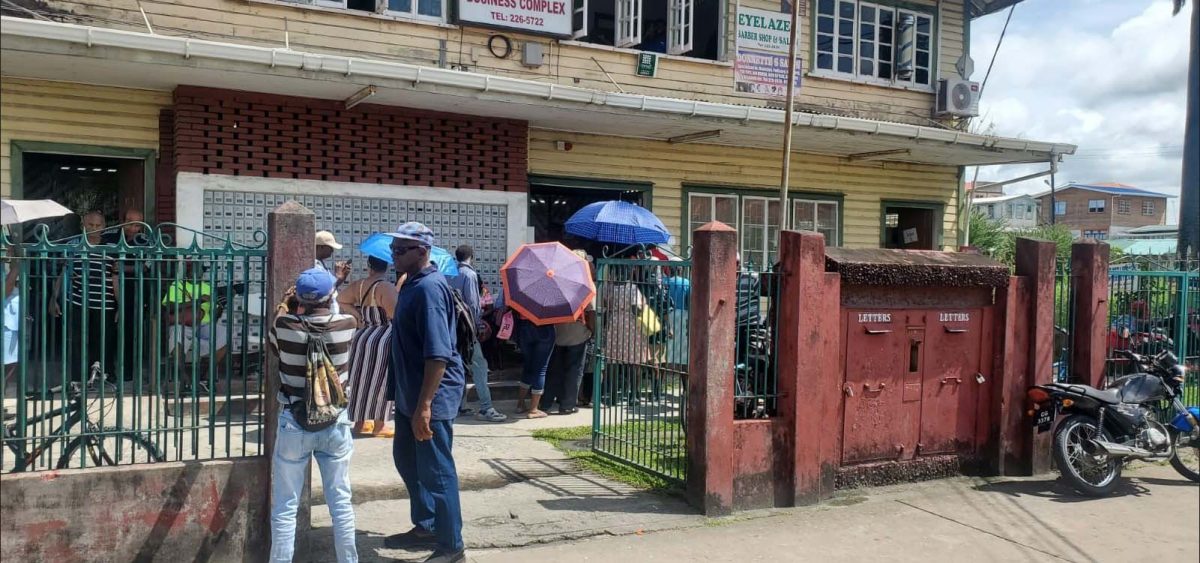 Persons waiting outside Bourda Post Office to uplift their old-age pension