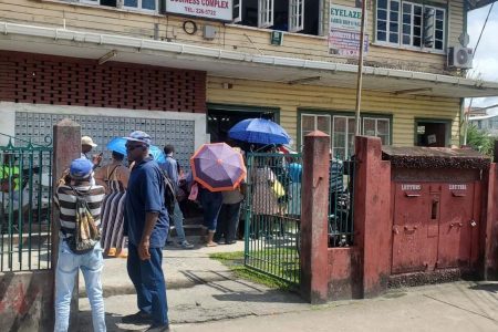 Persons waiting outside Bourda Post Office to uplift their old-age pension