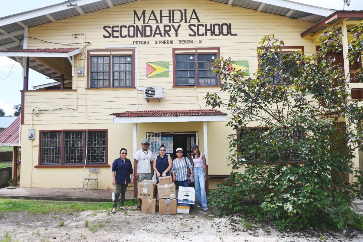 The APA team with the donation handed over to Mahdia Secondary School  (APA photo)