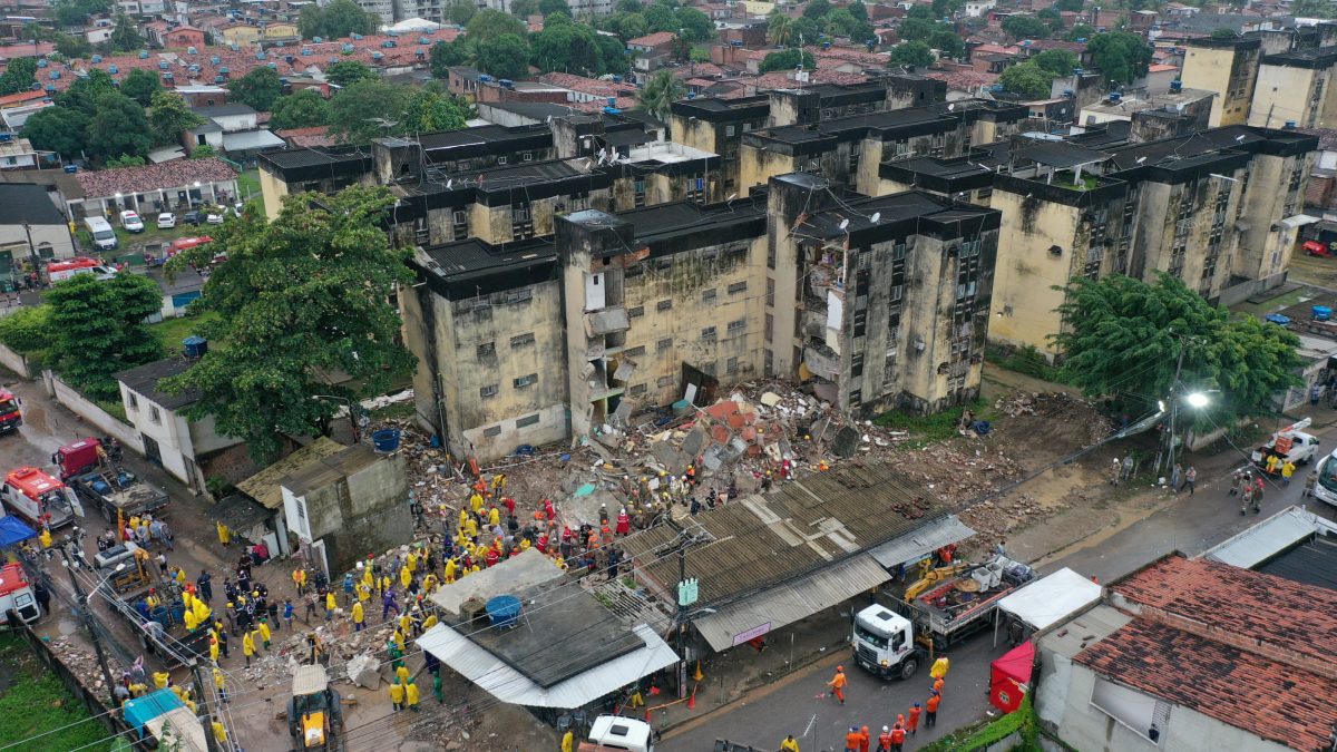 Rescue workers look for victims among debris of a building collapse in Recife Pernambuco state, Brazil July 7, 2023. REUTERS/Anderson Stevens