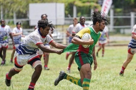 A scene from the Guyana/Cayman Islands ‘fifth place final’ yesterday at the Mona Campus ground in Jamaica. Guyana lost 0-52 in a matchup up of winless teams prior to the first whistle
