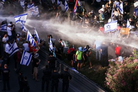 Police use a water cannon on protesters blocking a road that leads to the Prime Minter's office at a demonstration following a parliament vote on a contested bill that limits Supreme Court powers to void some government decisions, in Jerusalem July 24, 2023. — Reuters pic