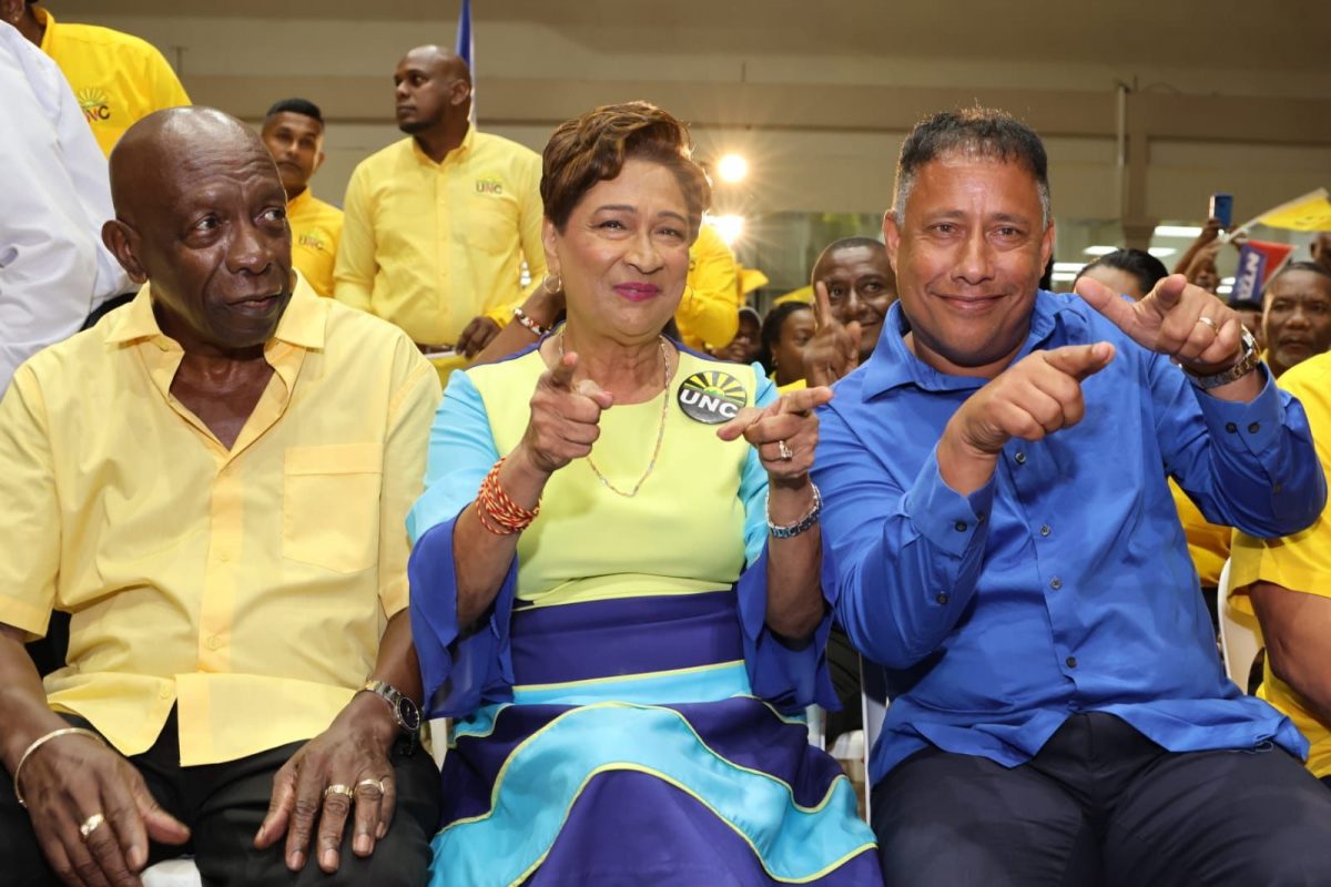 ILP founder Jack Warner, left, UNC leader Kamla Persad-Bissessar (centre) and NTA leader Gary Griffith sit together at the UNC’s “Accommodation 2023” Local Government meeting at the Centre of Excellence, Macoya, last night.