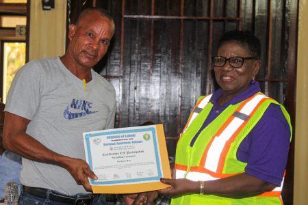 A certificate of participation being handed out