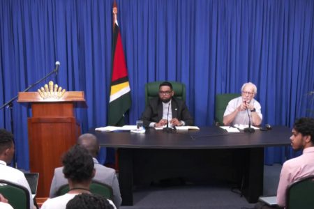 Kit Nascimento (right) at the head table at the press conference