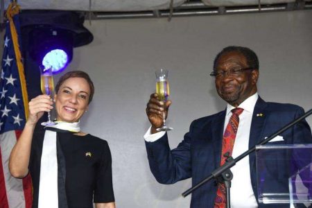United States Ambassador to Jamaica Nick Perry (right) and the island's Foreign Affairs Minister Kamina Johnson Smith raise their glasses in a toast to the 247th anniversary of America's declaration of independence at the US Embassy in Kingston on June 30. (Photo: Karl Mclarty) 