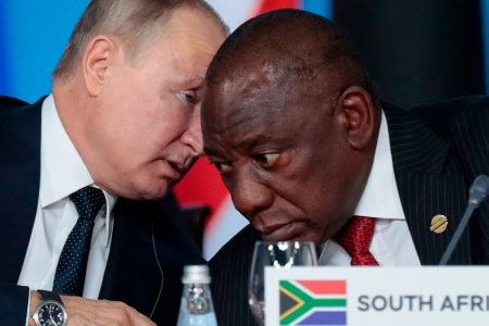 Vladimir Putin, left, and Cyril Ramaphosa. The South African president had faced a legal obligation to arrest the Russian president on an International Criminal Court indictment © AP 