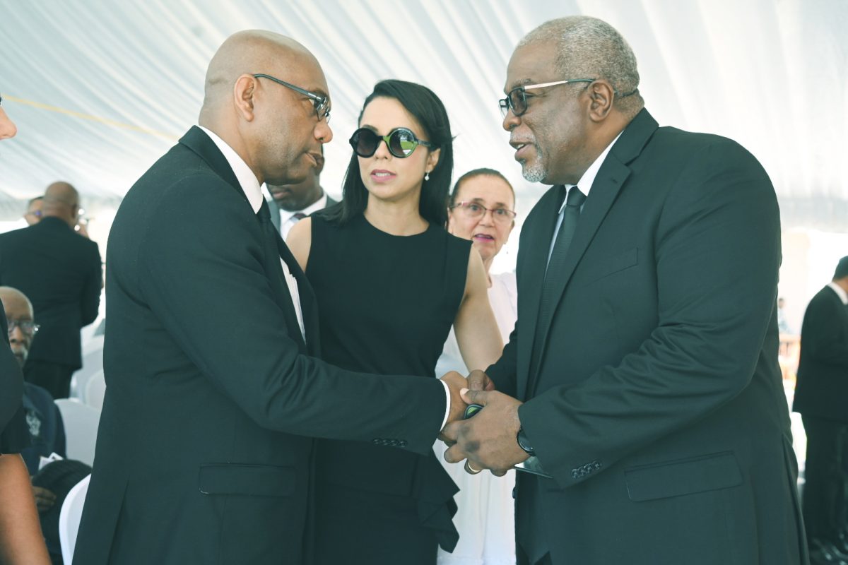 Ronald Chase (left) greeting Prime Minister Mark Phillips at the funeral.
At centre is one of Ashton Chase’s daughters, Pauline Chase.