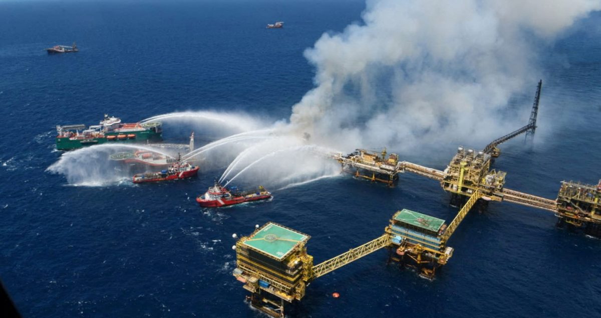 Boats spray water onto an offshore oil platform that caught fire at the Pemex’s Cantarell Field, in the Bay of Campeche, Gulf of Mexico, Mexico July 7, 2023. Courtesy Petroleos Mexicanos (PEMEX) @Pemex/Handout via 