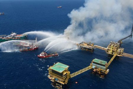 Boats spray water onto an offshore oil platform that caught fire at the Pemex’s Cantarell Field, in the Bay of Campeche, Gulf of Mexico, Mexico July 7, 2023. Courtesy Petroleos Mexicanos (PEMEX) @Pemex/Handout via 