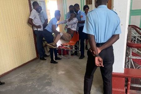 Wesley Bazil being placed onto a stretcher by the EMTs after collapsing upon learning that he had been found guilty of rape