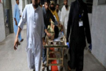 People transport a man, who was injured after a blast in Bajaur district of Khyber Pakhtunkhwa, at the Lady Reading Hospital in Peshawar, Pakistan July 30, 2023. (Reuters photo)