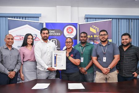 Vinash Chand (third from left) receiving his certification. (GNBS photo)