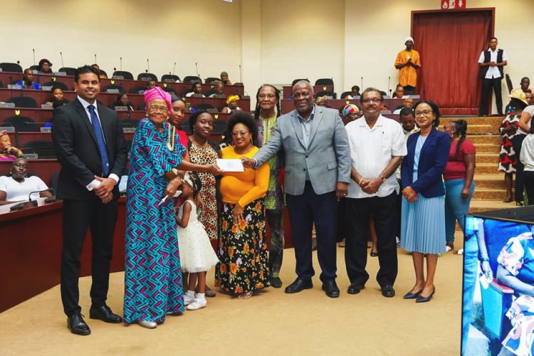 Prime Minister Mark Phillips (third from right) making a presentation to one of the groups yesterday. (Office of the Prime Minister photo)