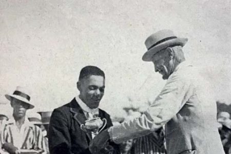 A young Alma Hunt, the hero of the Somerset team in the 1930s, receiving one of his numerous trophies. Hunt broke all records for individual scoring in Cup Matches (Photo from thebermudian.com)
