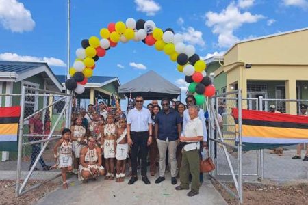 Chairman of the PAC Board, Robert Persaud (centre) and other representatives and officials pose in front of the new building (DPI photo)
