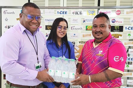 Colin King, Brand Manager of Water Products in the presence of Shensia Fredericks, Brand Manager of Trisco/Pinehill Products, presenting the symbolic case of water to Co-Director of the ‘One Guyana’ T10 Blast John Ramsingh
