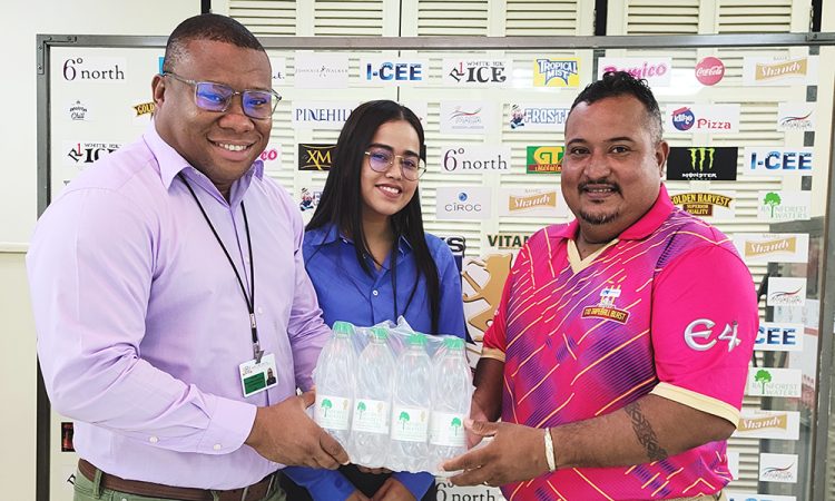 Colin King, Brand Manager of Water Products in the presence of Shensia Fredericks, Brand Manager of Trisco/Pinehill Products, presenting the symbolic case of water to Co-Director of the ‘One Guyana’ T10 Blast John Ramsingh
