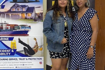 Sasha Shariff (left), winner of the Diamond Fire and General Insurance 2023 Women’s Qualifiers Chess Tournament poses with Secretary of the Guyana Chess Federation Marcia Lee 