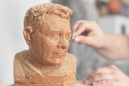 An artist working with clay (Image by Freepik)