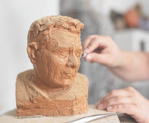 An artist working with clay (Image by Freepik)