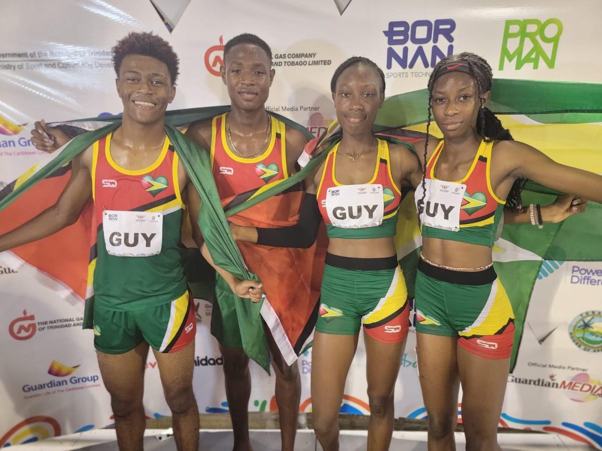 Team Guyana’s Javon Roberts, Malachi Austin, Narissa McPherson, and Tianna Springer are all smiles after smashing the Youth Commonwealth Games meet record in the Mixed 4x400m relay event Hasely Crawford stadium, Trinidad and Tobago