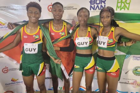 Team Guyana’s Javon Roberts, Malachi Austin, Narissa McPherson, and Tianna Springer are all smiles after smashing the Youth Commonwealth Games meet record in the Mixed 4x400m relay event Hasely Crawford stadium, Trinidad and Tobago