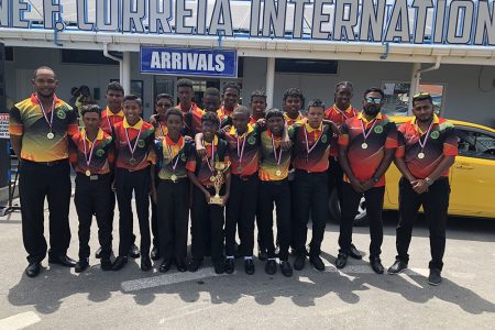 The Guyana under-13 squad pose with their winnings.
