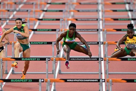 Tobi Amusan, centre, who advanced to the semi-finals of the 100m hurdles at the world championships, had a recent doping suspension lifted recently