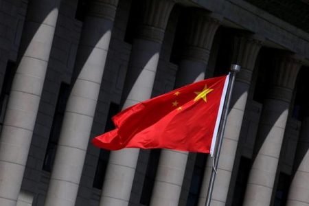 A Chinese flag flutters in front of the Great Hall of the People in Beijing, China, May 27, 2019. REUTERS/Jason Lee