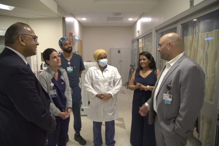 Health Minister Dr Frank Anthony (left) in discussion with some of the doctors at the burn facility