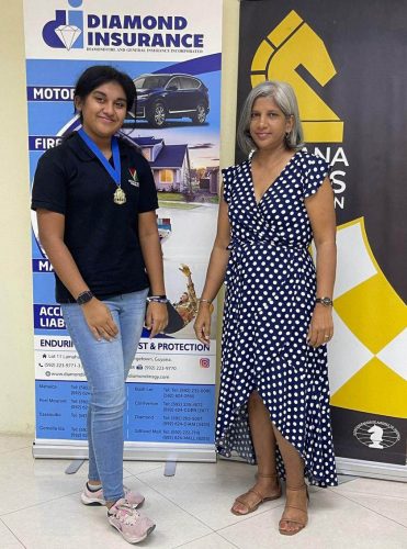 Italy Ton-Chung (left) is representing Guyana at the CAC Chess Championship in Trinidad and Tobago which begins tomorrow. At right is Secretary of the Guyana Chess Federation Marcia Lee 