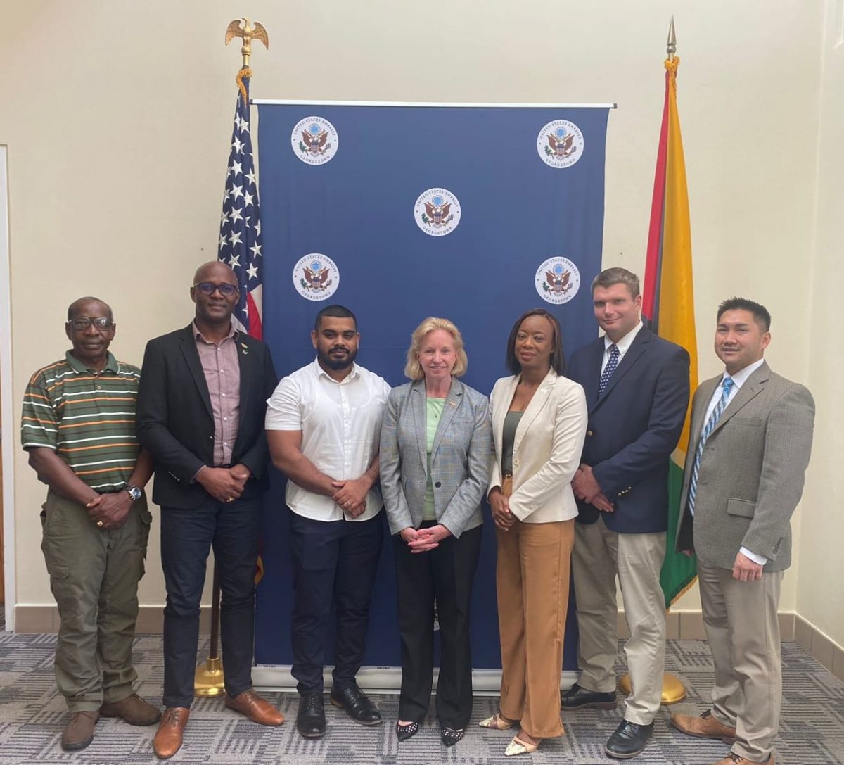 US Ambassador Sarah-Ann Lynch is fourth from left and GCCI President Kester Hutson is second from left. 