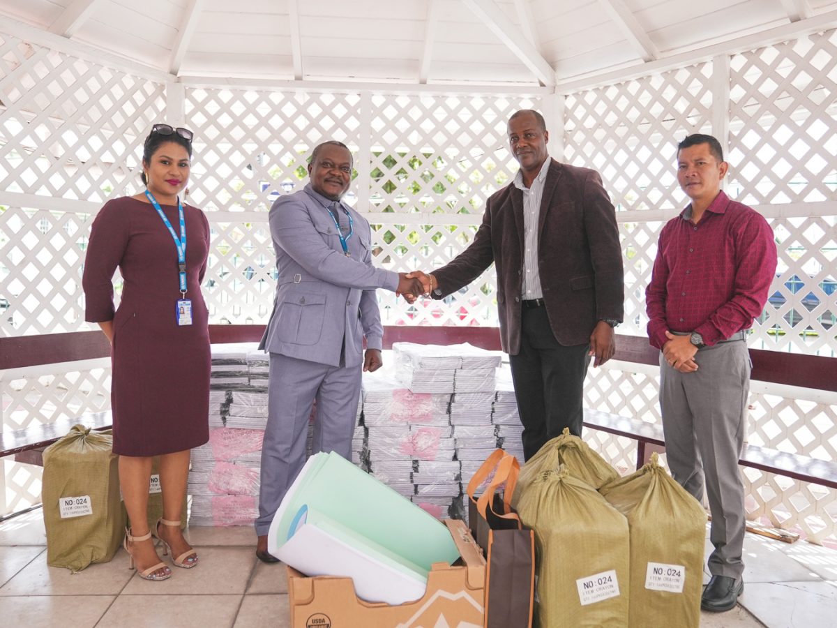 UNHCR Head of Office,  Henri–Sylvain Yakara (second from left) handing over the ESL resources to Permanent Secretary, Alfred King in the presence of Deputy Chief Education Officer, for Amerindian and Hinterland Education Development (AHED), Marti DeSouza (right) and UNHCR’s Assistant Education Officer, Danielle Dipoo. (Ministry of Education photo) 