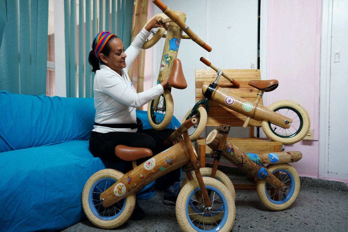 Nayvis Dias, founder of Velo Cuba, shows eco-friendly bamboo bicycles at her office in Havana, Cuba, July 21, 2023. REUTERS/Alexandre Meneghini