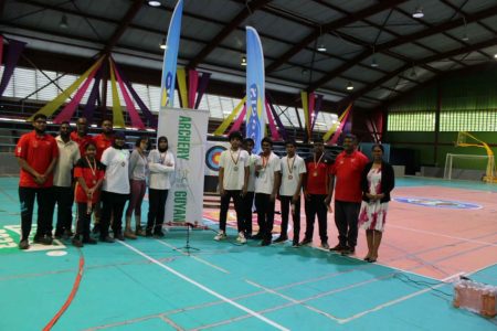 The top three finishers of the male and female categories along with other participants pose with their spoils following the conclusion of Archery Guyana’s Youth Championship.
 
