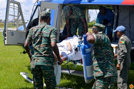 The Guyana Defence Force’s medial team evacuated a 17 year-old female from Mabaruma Region 1 to Georgetown yesterday for emergency medical attention. The patient is now in a stable condition receiving medical attention at the Georgetown Public Hospital. In this photograph the GDF is seen transporting the teenager to the aircraft. (GDF photo)