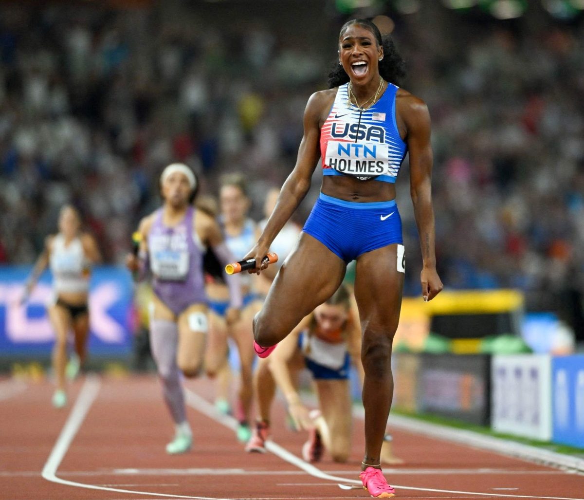 Alexis Holmes left a fallen Femke Bol in her wake as she grabbed a dramatic gold medal for the US team in the mixed 4x400 relay yesterday at the world championships. (Reuters photo)
