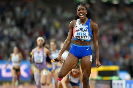Alexis Holmes left a fallen Femke Bol in her wake as she grabbed a dramatic gold medal for the US team in the mixed 4x400 relay yesterday at the world championships. (Reuters photo)
