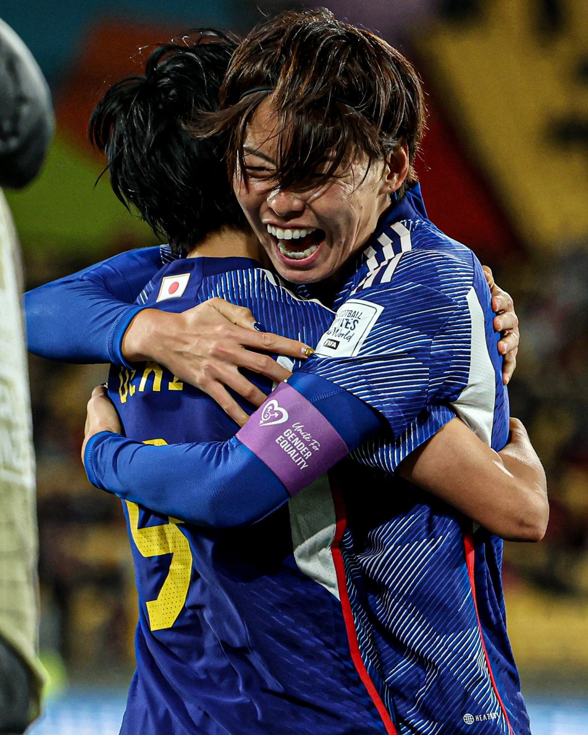  Japanese players celebrate after their 4-0 defeat of Spain.