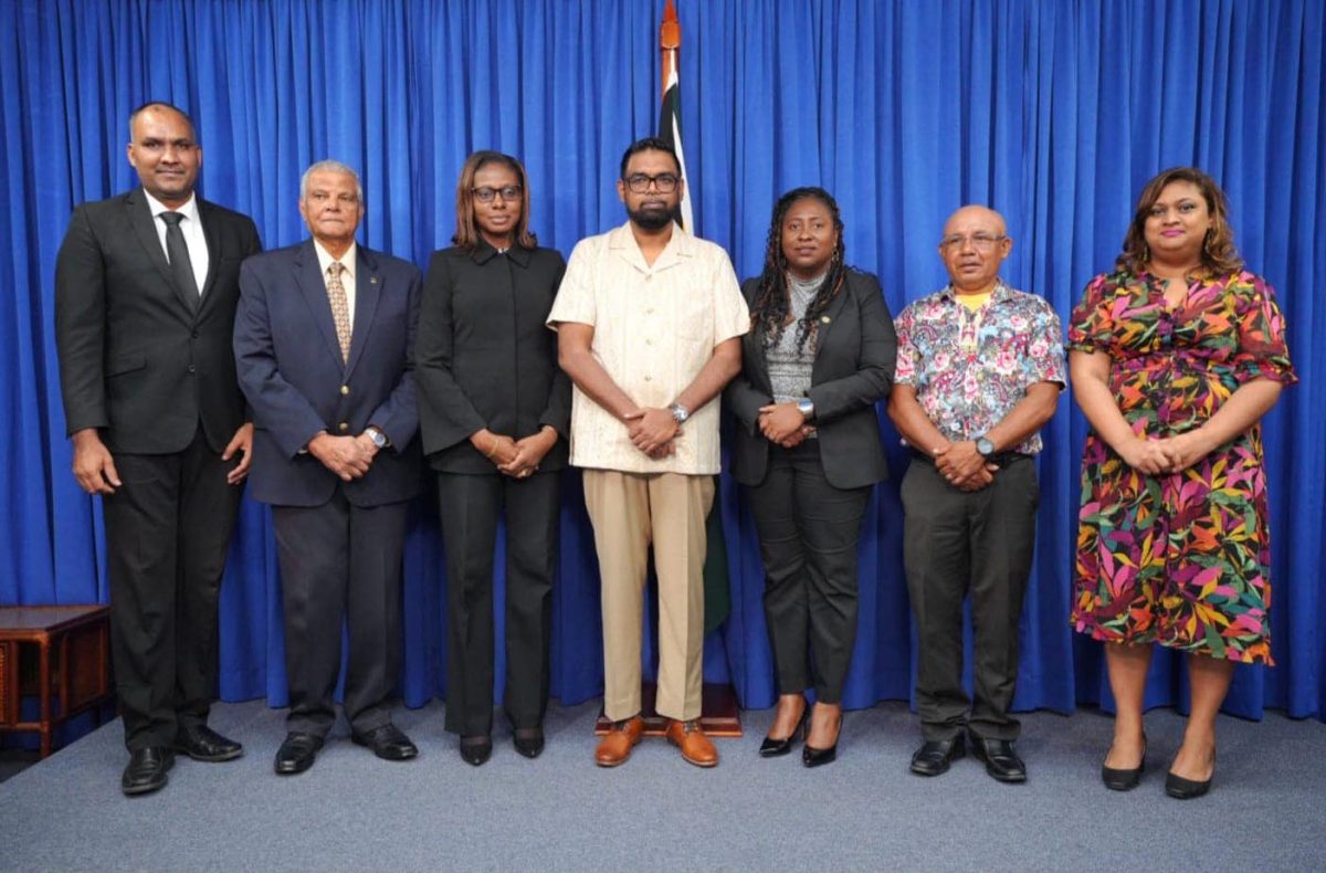 From left are CoI Secretary Javed Shadick, Chair of the Inquiry Major General (rtd) Joe Singh, Chief Magistrate (acting) Sherdel Isaacs-Marcus, President Irfaan Ali, Head of the  University of Guyana’s Law Department Dr. Kim Kyte-Thomas,  Chairman of the National Toshaos Council Derrick John and Education Minister Priya Manickchand. (Office of the President photo)