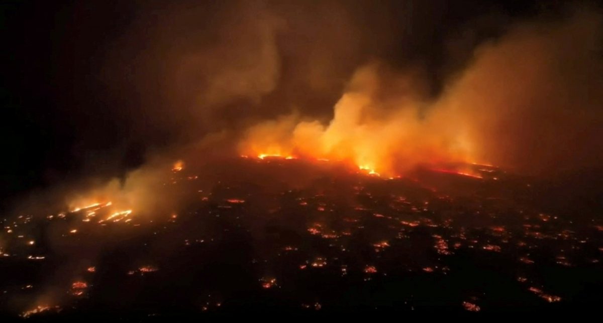 An aerial view of a wildfire in Kihei, Maui County, Hawaii, U.S., August 8, 2023 in this screen grab obtained from a social media video.   Clint Hansen of Maui Real Estate Radio/TMX via REUTERS