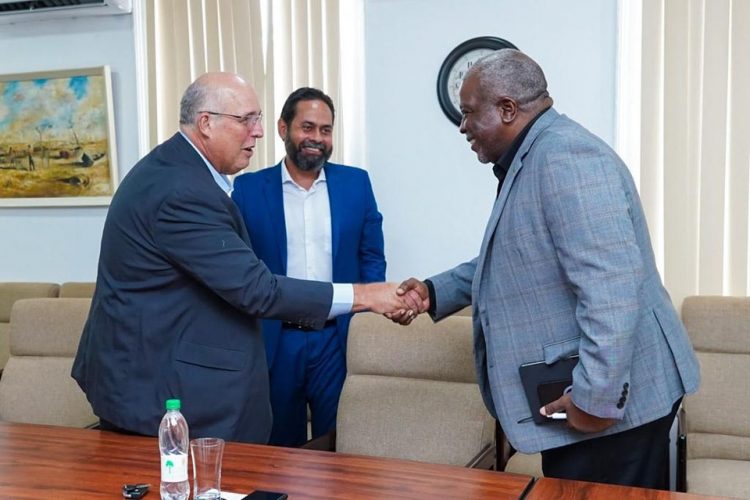 Prime Minister Mark Phillips (right) meeting members of the company on Monday (Office of the Prime Minister photo)