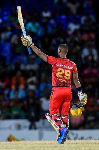 Nicholas Pooran salutes the crowd after scoring a half-century against St Kitts and Nevis Patriots on Sunday night. (Photo courtesy CPLT20/Getty Images)
