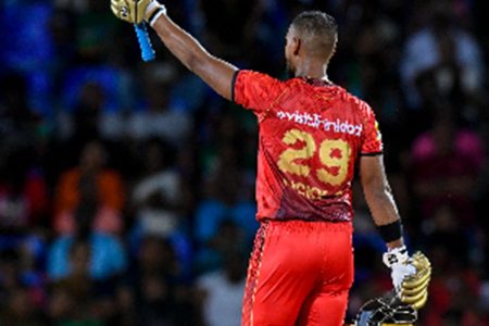 Nicholas Pooran salutes the crowd after scoring a half-century against St Kitts and Nevis Patriots on Sunday night. (Photo courtesy CPLT20/Getty Images)
