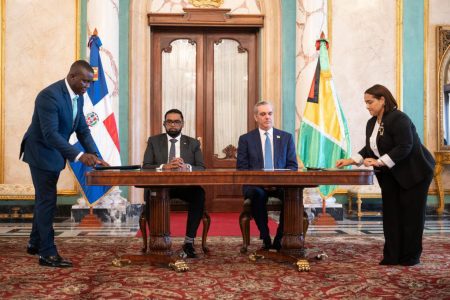 President Irfaan Ali (seated at left) next to Dominican Republic President, Luis Abinader (Office of the President photo)