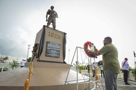 President Irfaan Ali presenting a wreath (Office of the President photo)