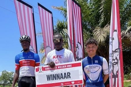 Kaieteur Attack Racing Cycle Club standouts, Kwame Ridley
(centre) and Romello Crawford (left) occupied the top two spots in the KFC/SWU Brokopondo Classic road race this past weekend in Suriname. 