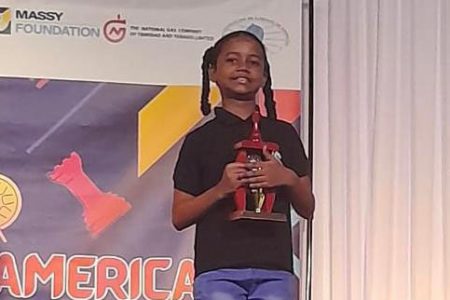Kataleya Sam on the podium after placing third at the CAC Youth Chess Festival in Trinidad and Tobago yesterday.