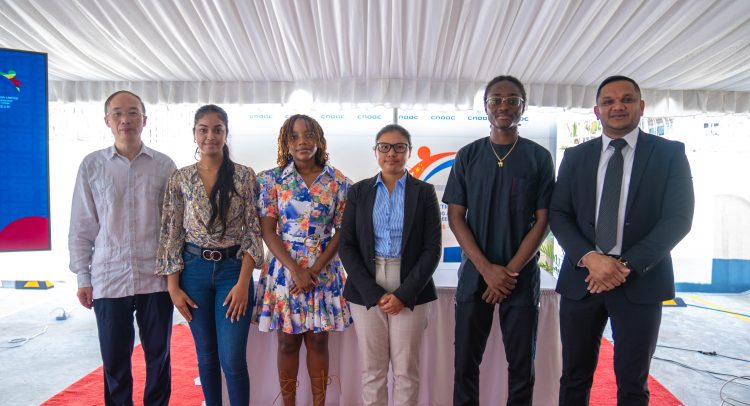 CPGL President Liu Xiaioxiang (left) and Minister of Natural Resources, Vickram Bharrat with the scholarship awardees.